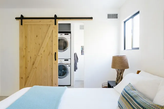 a bedroom with a bed and a shower