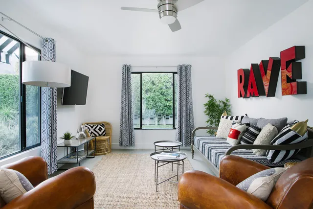 a bedroom with a bed and a mirror