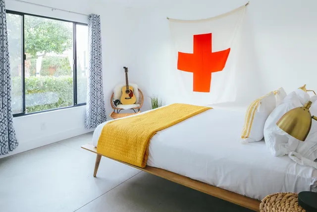 a bedroom with a bed and window