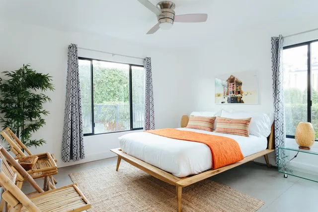 a bedroom with a bed and a window