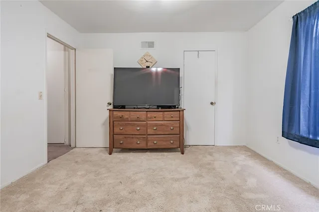 a room with furniture and flat screen tv