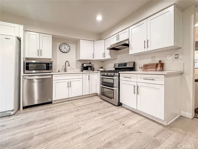 a view of an empty room with closet