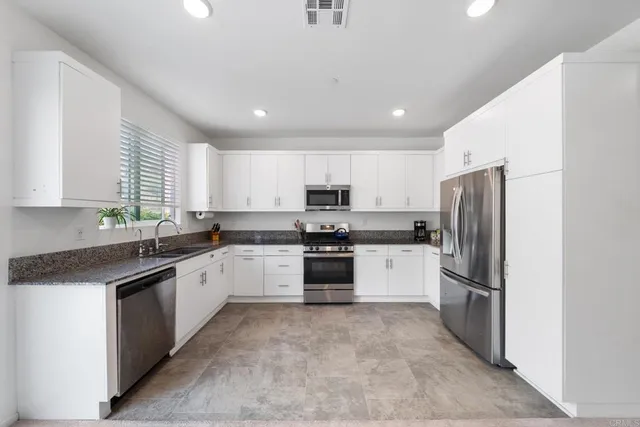 a kitchen with a sink and counter top space