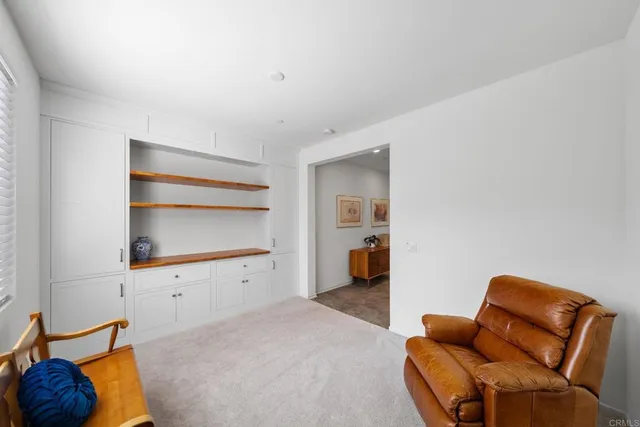 a view of a livingroom with furniture and window