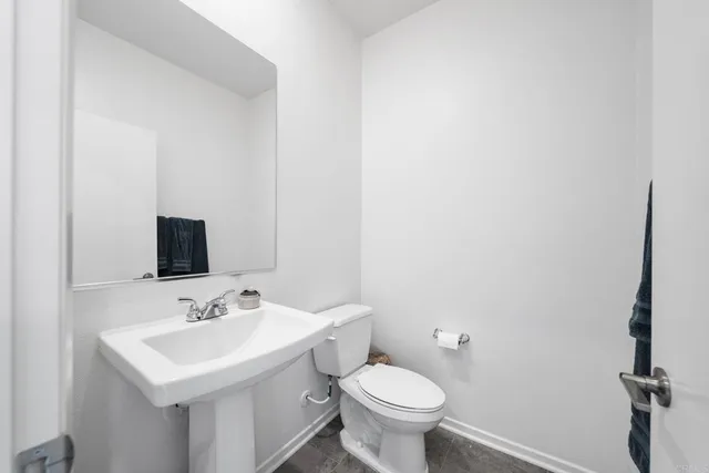 a view of a hallway with windows and lounge chair