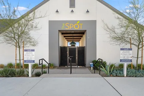 a dining hall with lots of tables and chairs