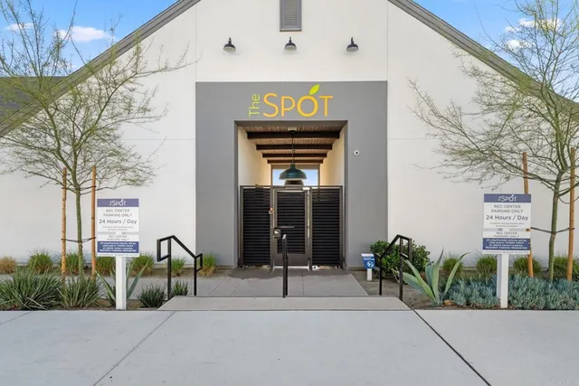 a dining hall with lots of tables and chairs