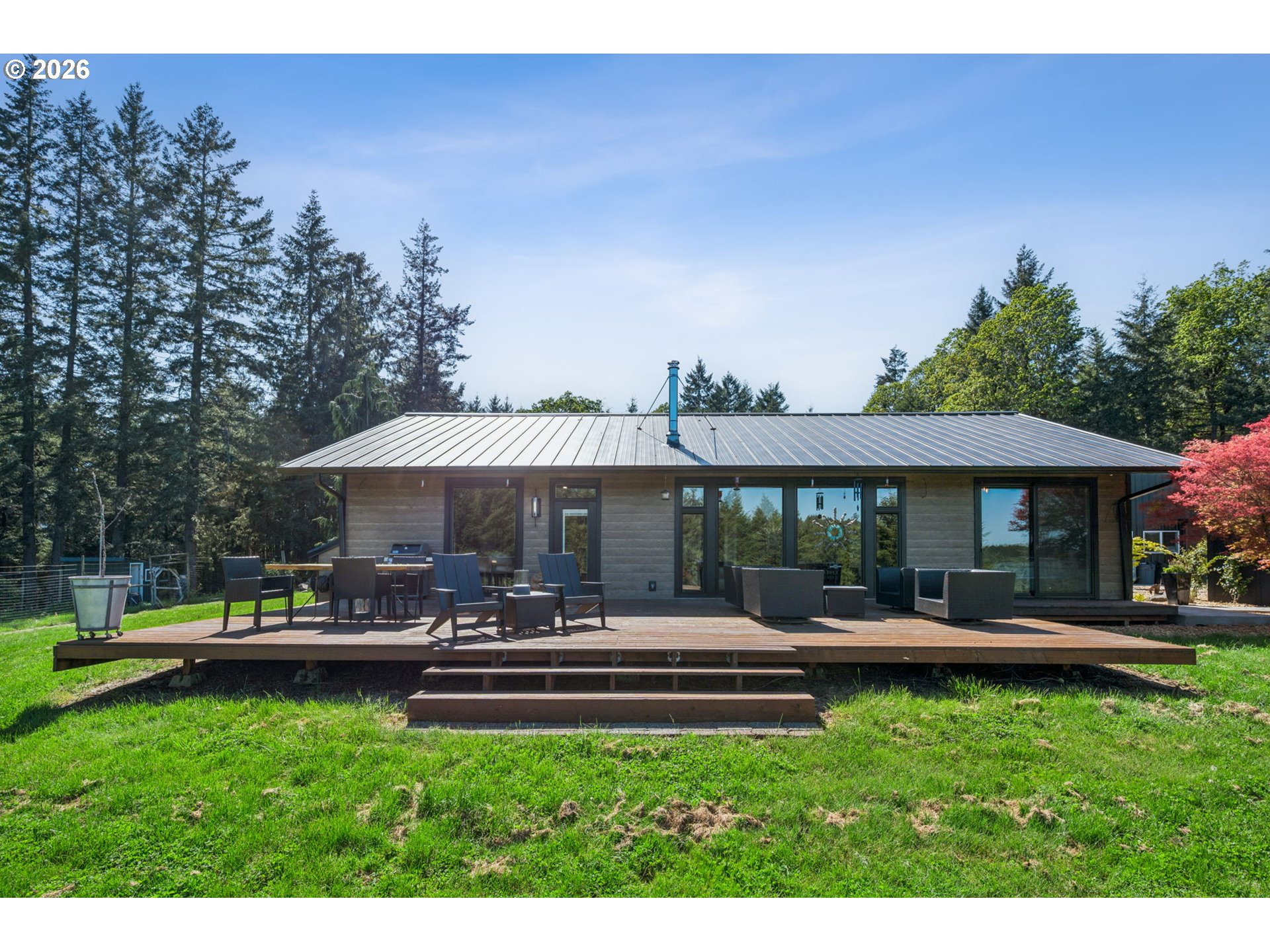 18600 Northwest Meadowlake Road Yamhill, OR 97148 - Photo 28 of 47 a backyard of a house with yard and outdoor seating