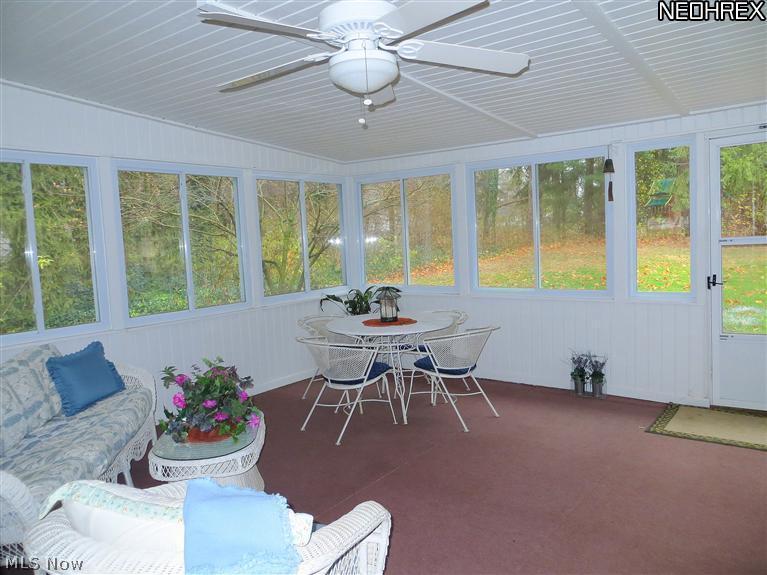 2357 Middleton Road Hudson, OH 44236 - Photo 14 of 25 Vaulted Sun Rm Porch complete with Gardeners Built-in Potting Table! Ceiling Fan. Tranquil Backyard Views. Stamped Concrete Patio and Walk Way.