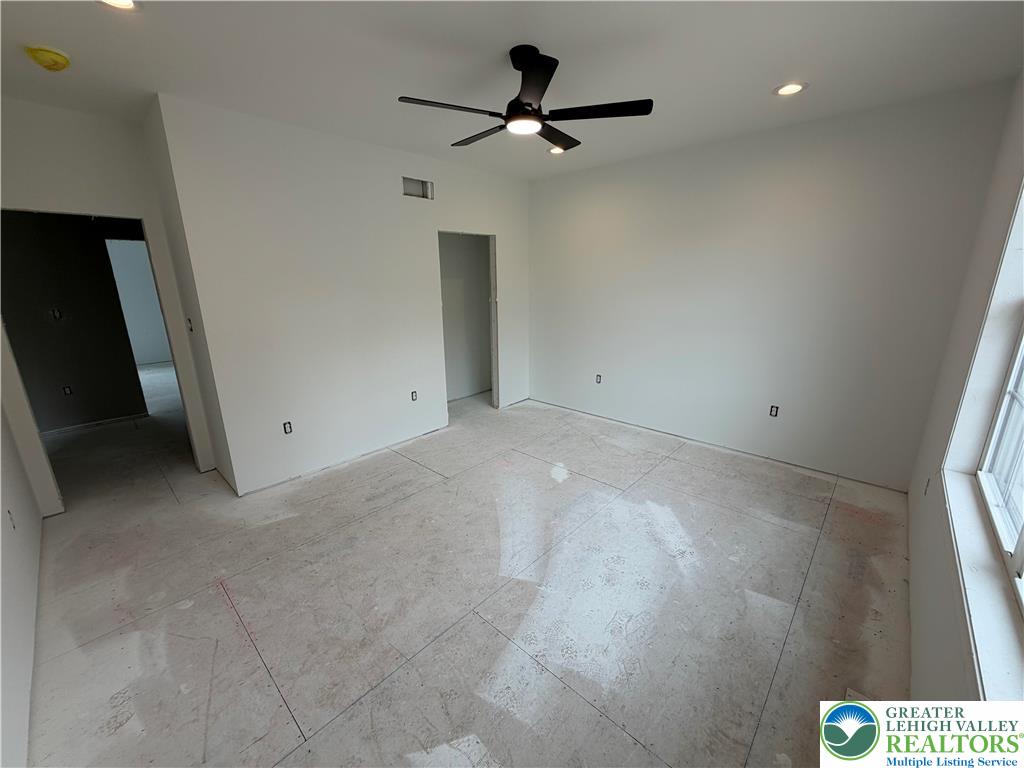 1899 Kecks Road Breinigsville, PA 18031 - Photo 24 of 30 This bright room features a modern ceiling fan and recessed lighting, ready for your personal touch.