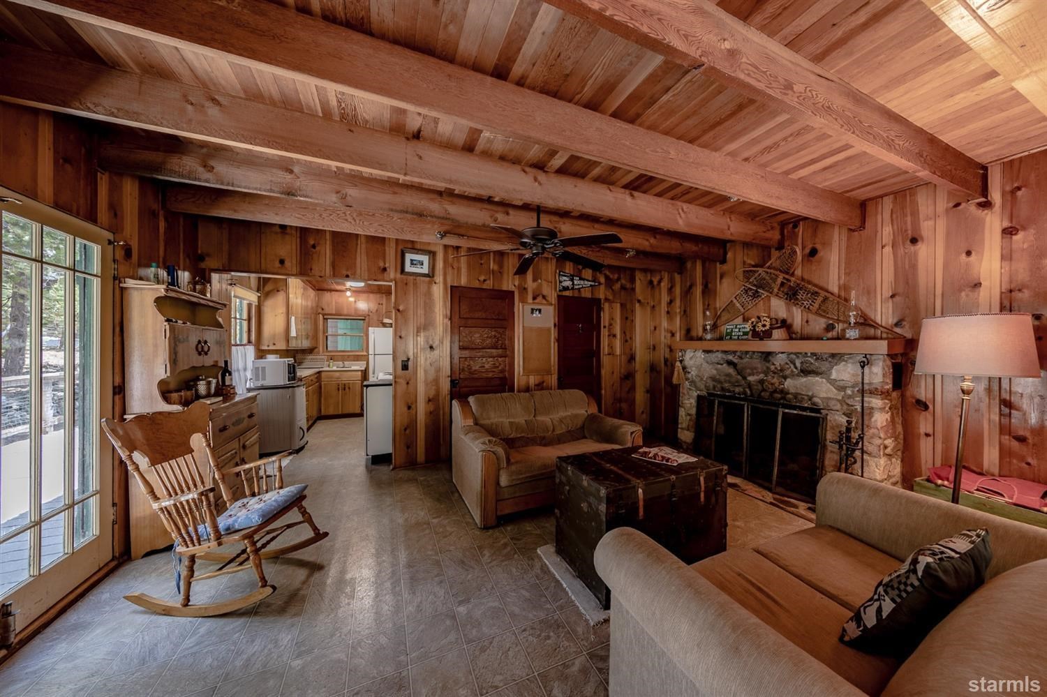 9 42 Milestone Trail Twin Bridges, CA 95735 - Photo 11 of 15 a living room with furniture a fireplace and a flat screen tv