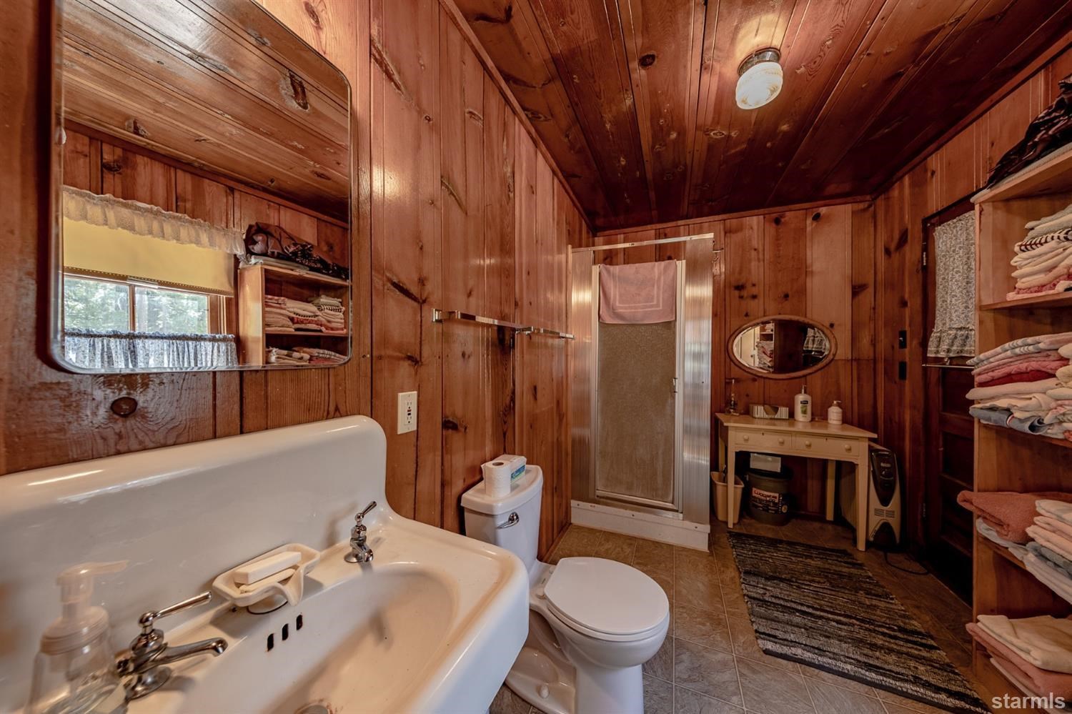 9 42 Milestone Trail Twin Bridges, CA 95735 - Photo 13 of 15 a bathroom with a sink a toilet and shower