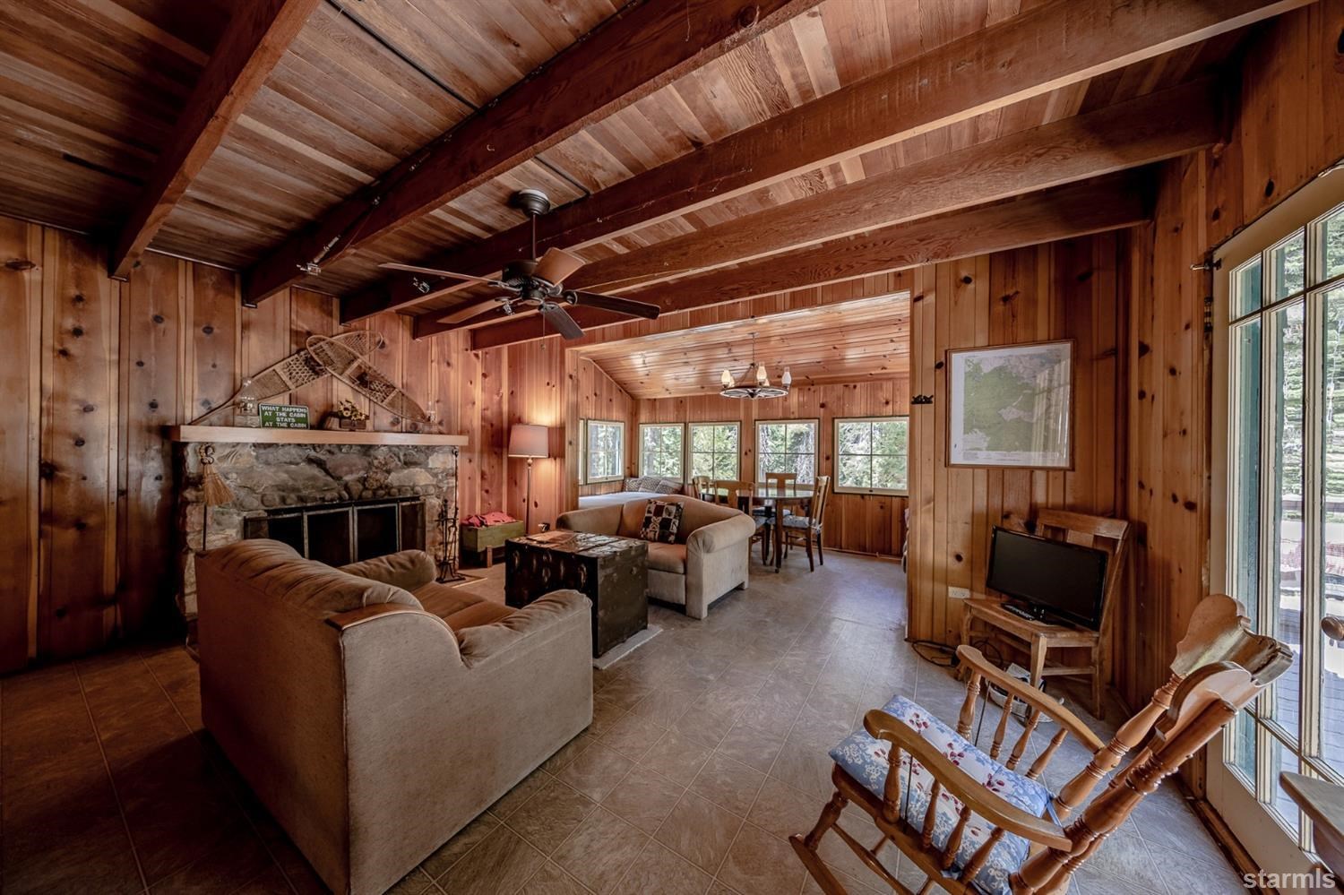 9 42 Milestone Trail Twin Bridges, CA 95735 - Photo 9 of 15 a living room with furniture a fireplace and a flat screen tv