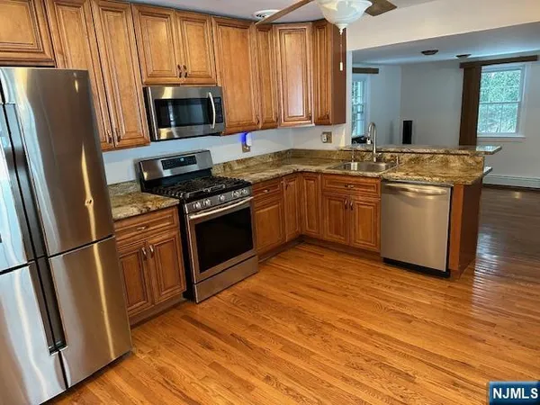 a kitchen with a sink stove and refrigerator