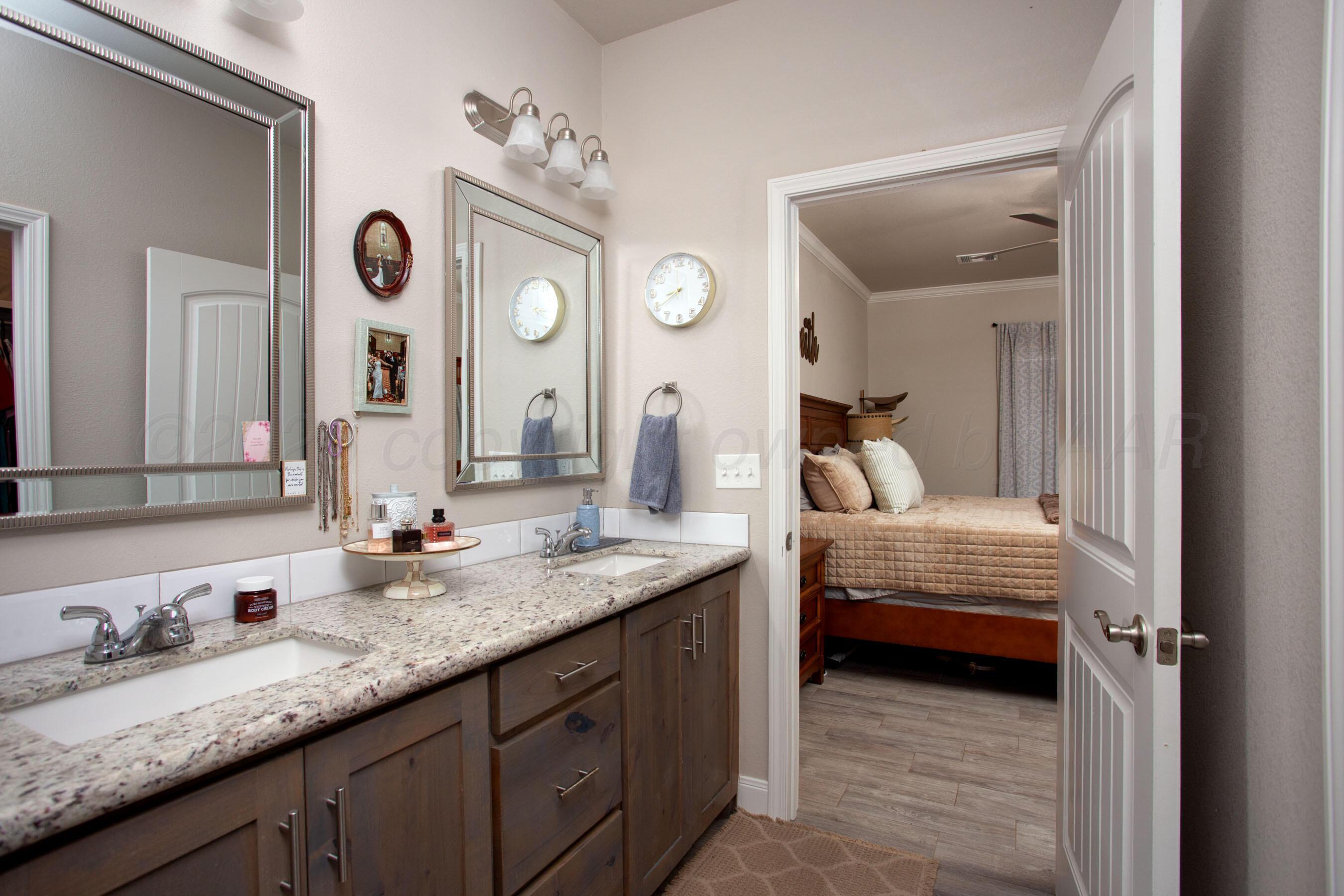 57 Cm Lane Canyon, TX 79015 - Photo 14 of 26 a en suite bathroom with double vanity sinks and a mirror