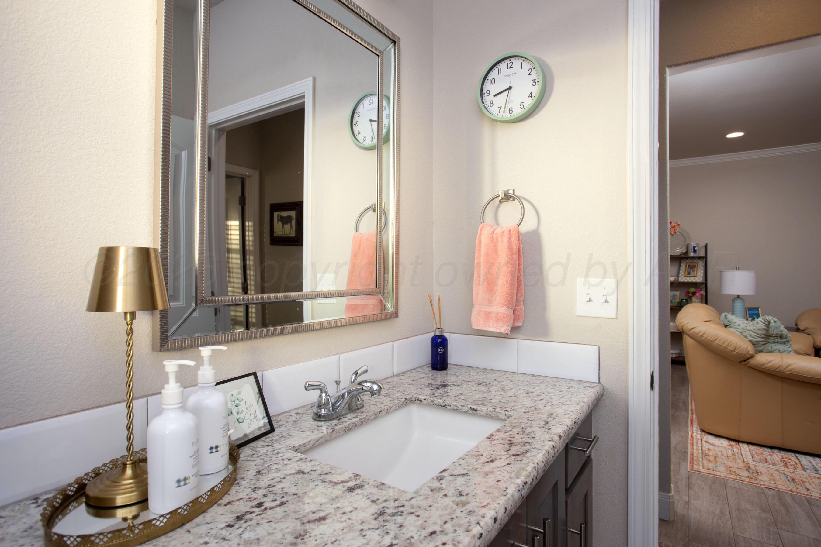 57 Cm Lane Canyon, TX 79015 - Photo 20 of 26 a bathroom with a granite countertop sink and a mirror