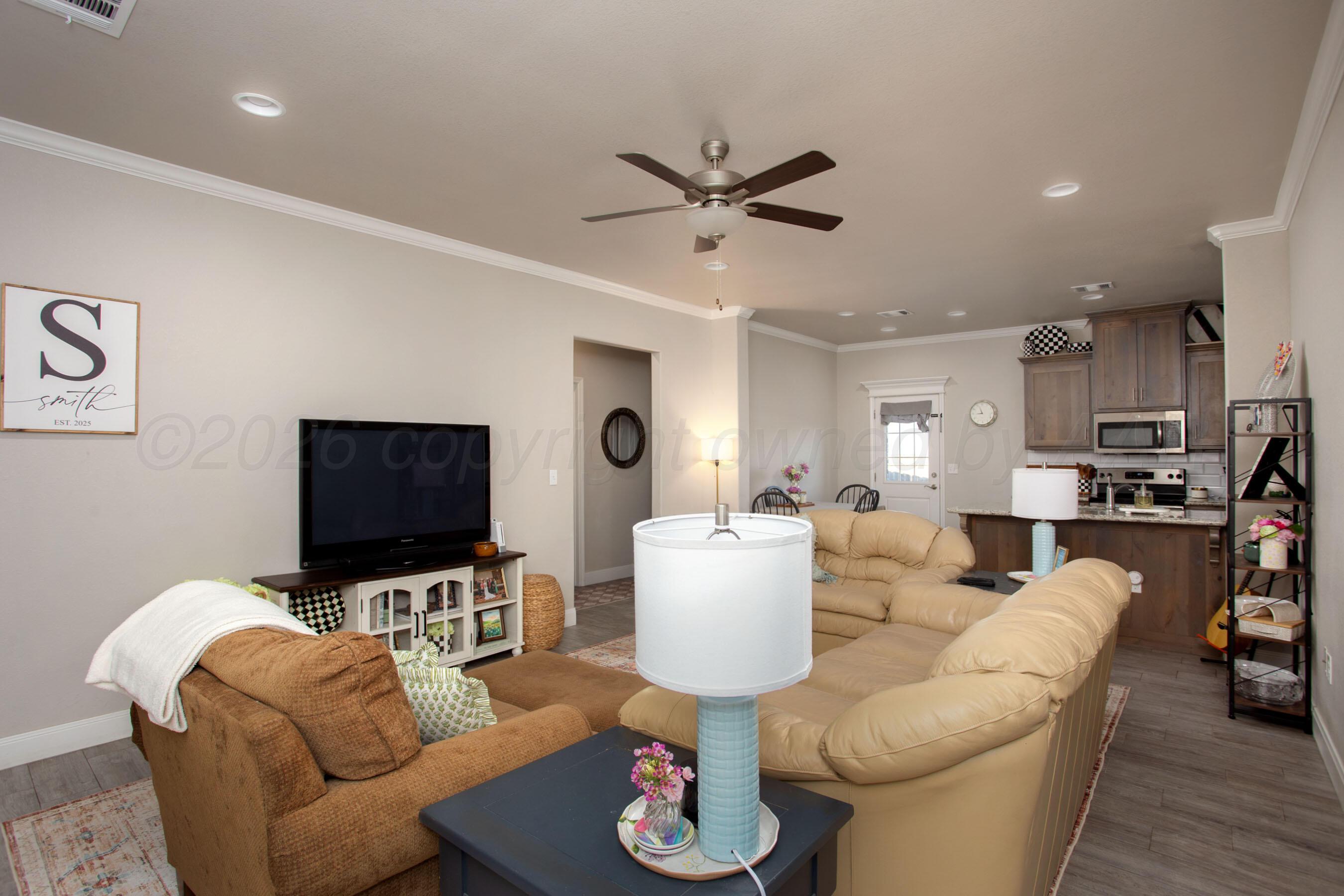 57 Cm Lane Canyon, TX 79015 - Photo 4 of 26 a living room with furniture and a flat screen tv
