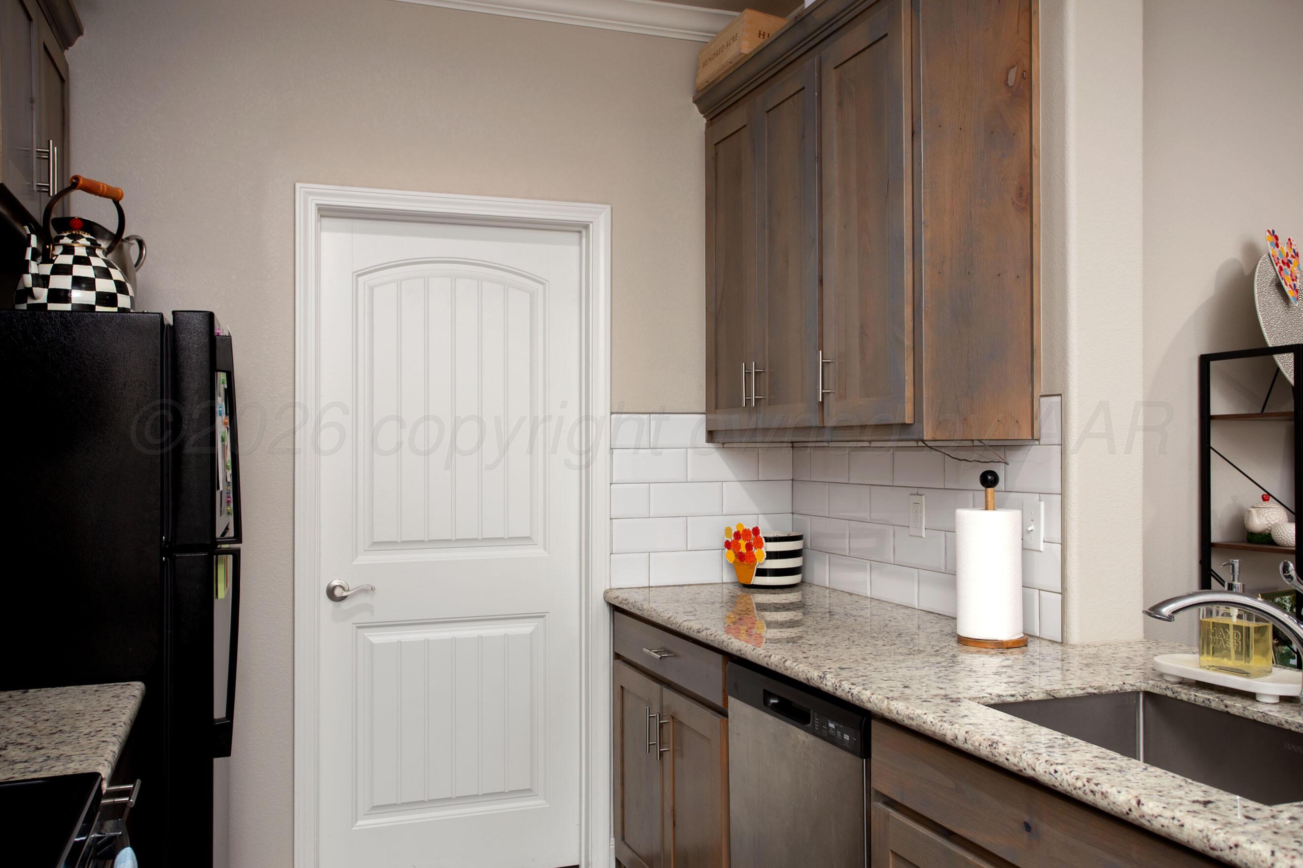 57 Cm Lane Canyon, TX 79015 - Photo 8 of 26 a kitchen with stainless steel appliances granite countertop a refrigerator and a sink