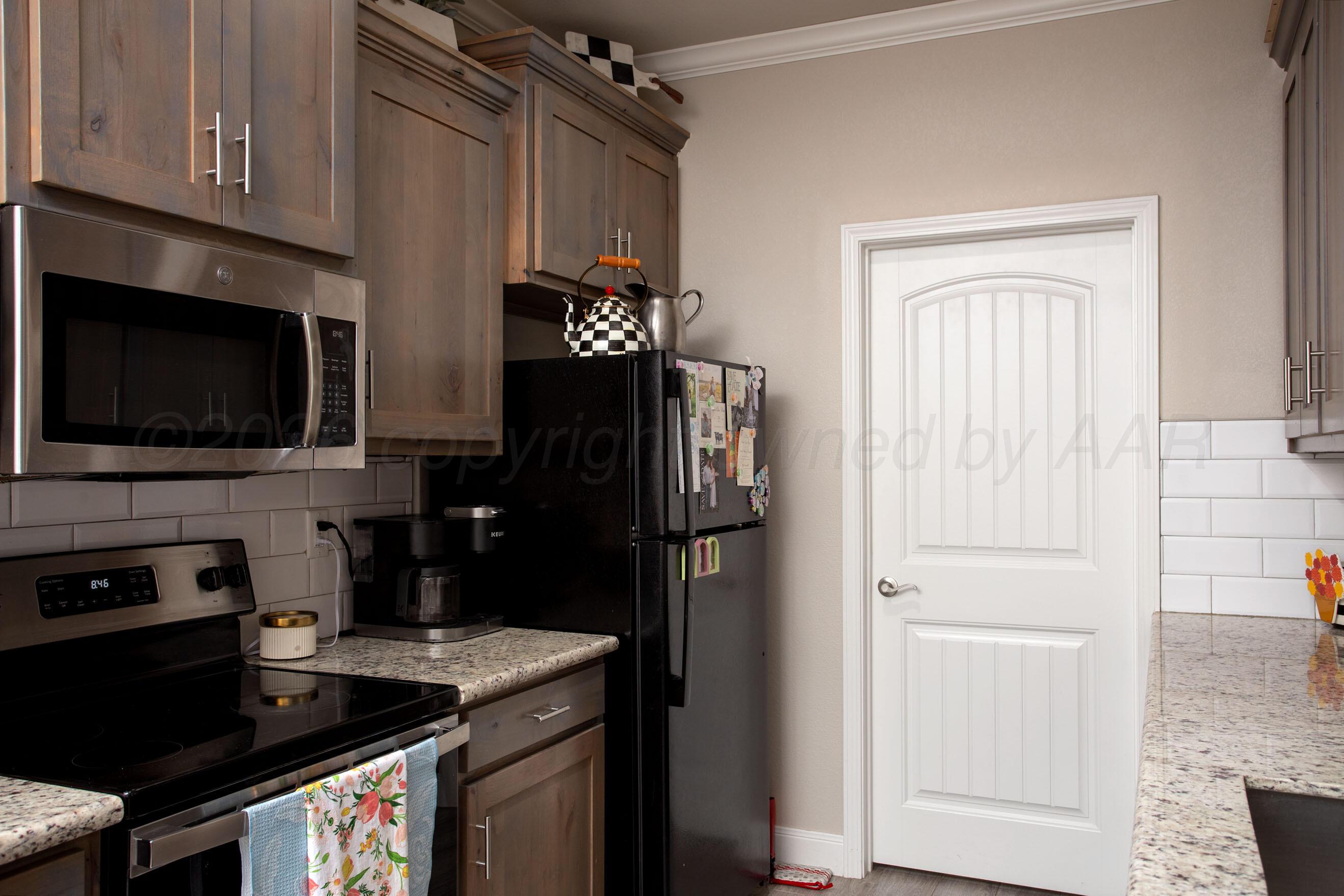 57 Cm Lane Canyon, TX 79015 - Photo 9 of 26 a kitchen with a refrigerator stove and microwave