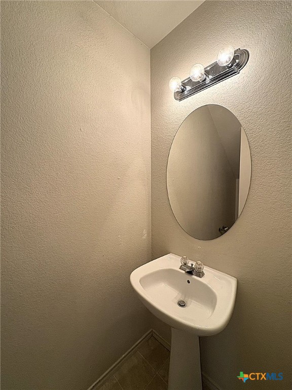 1611 Inca Drive, Unit D Harker Heights, TX 76548 - Photo 3 of 9 a bathroom with a sink and a mirror