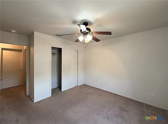 a view of a chandelier fan in a room