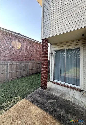 a view of a backyard of the house