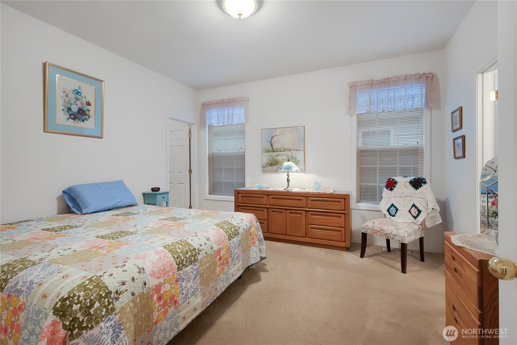 8235 Sweetbrier Loop Southeast Olympia, WA 98513 - Photo 13 of 24 a bedroom with a bed and a furniture