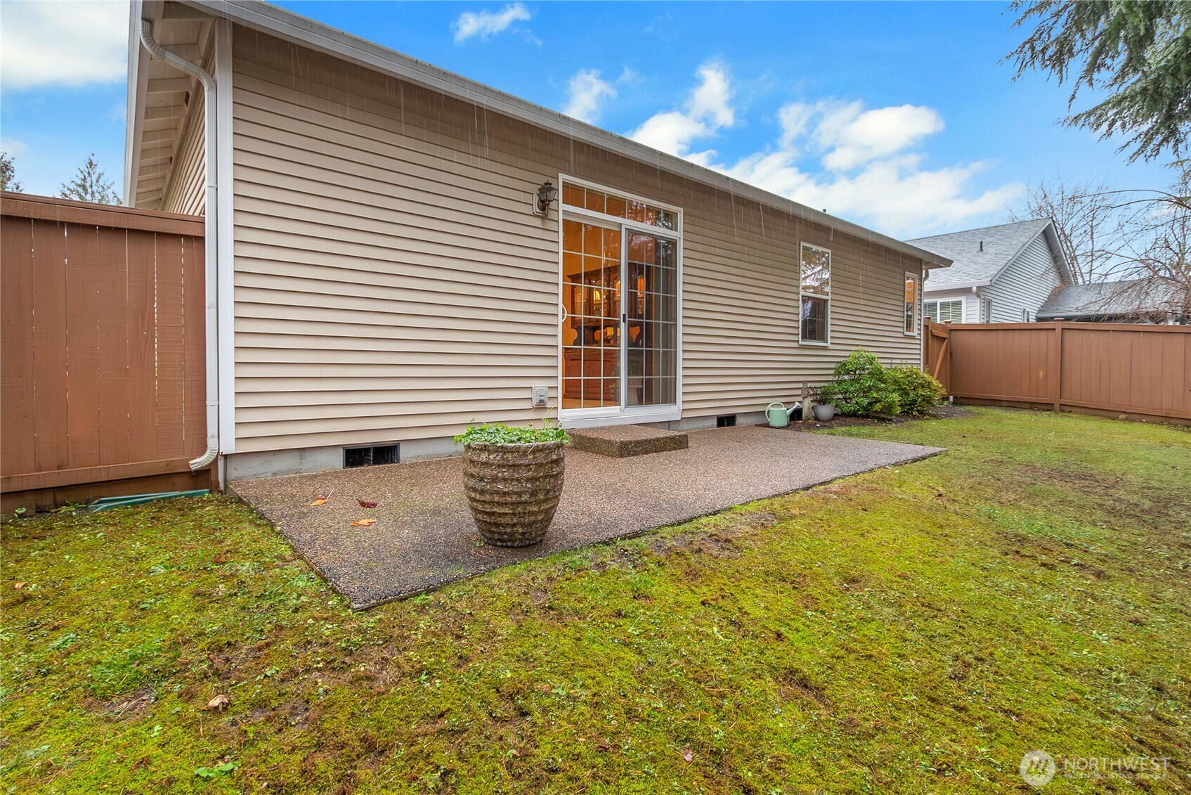 8235 Sweetbrier Loop Southeast Olympia, WA 98513 - Photo 19 of 24 a view of a backyard with plants and a patio