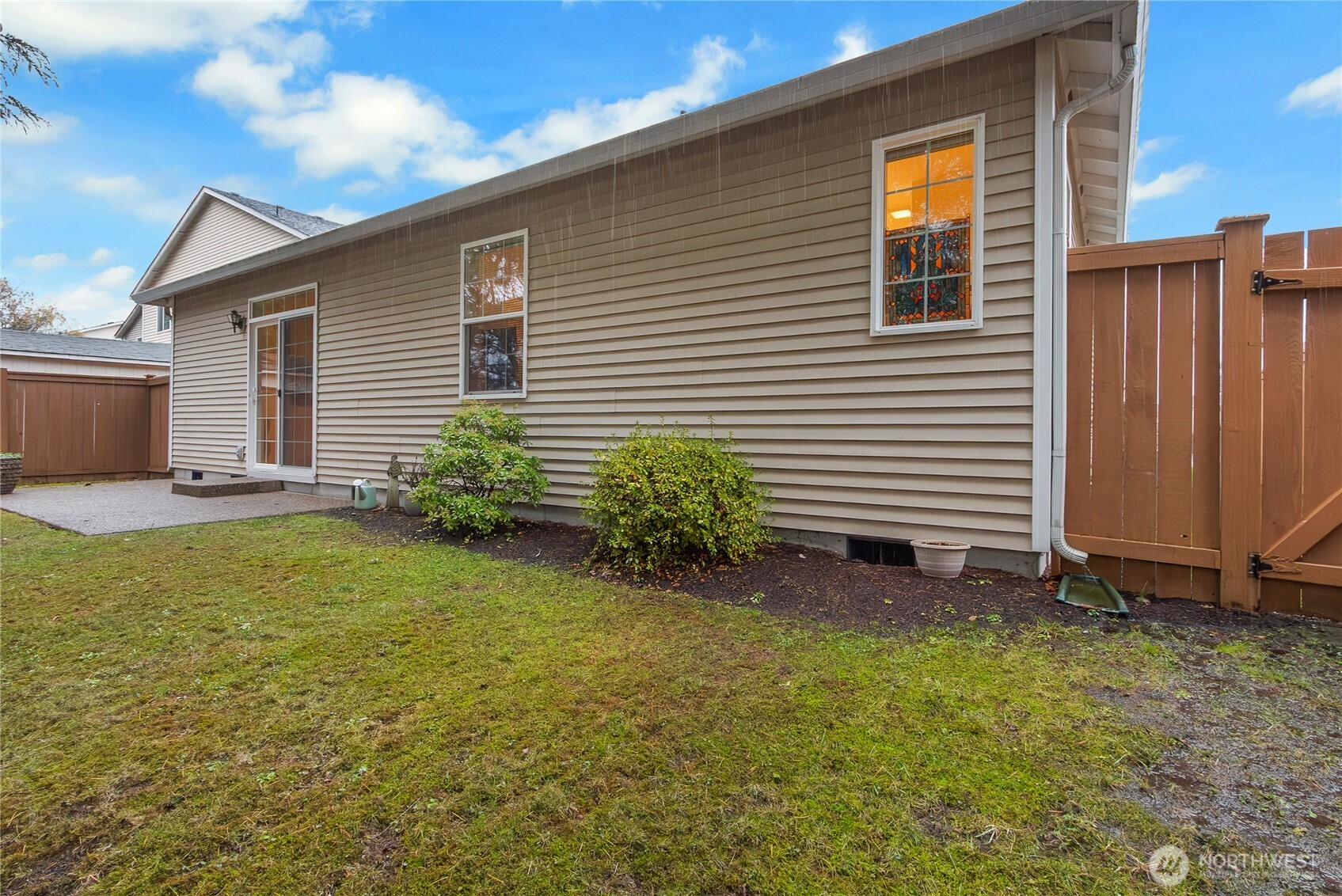 8235 Sweetbrier Loop Southeast Olympia, WA 98513 - Photo 20 of 24 a view of a house with backyard and garden