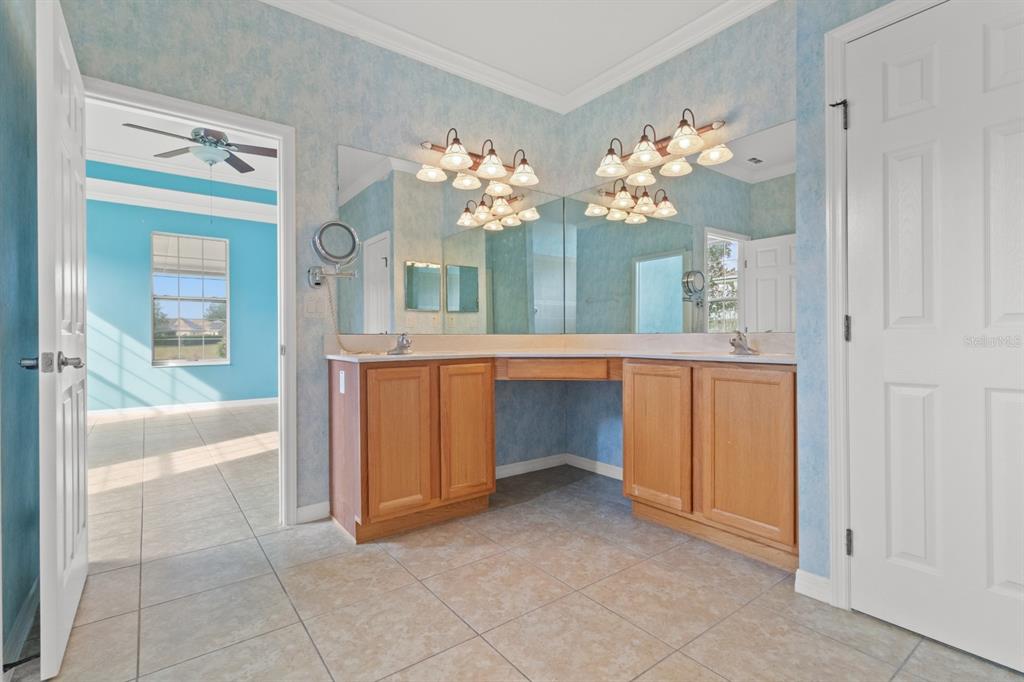 8251 Southwest 84th Place Road Ocala, FL 34481 - Photo 16 of 38 a large bathroom with a tub shower and sink
