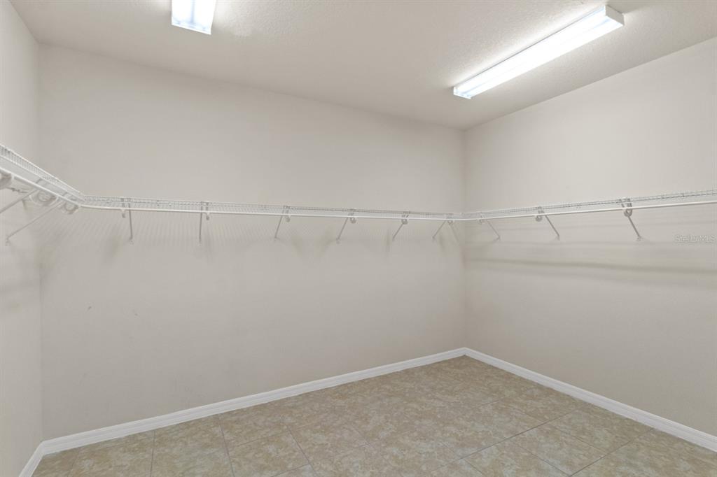 8251 Southwest 84th Place Road Ocala, FL 34481 - Photo 19 of 38 a view of a room with racks on the wall