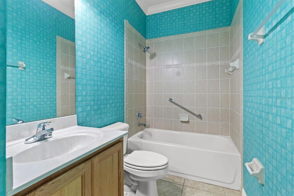 8251 Southwest 84th Place Road Ocala, FL 34481 - Photo 25 of 38 a bathroom with a sink and a mirror