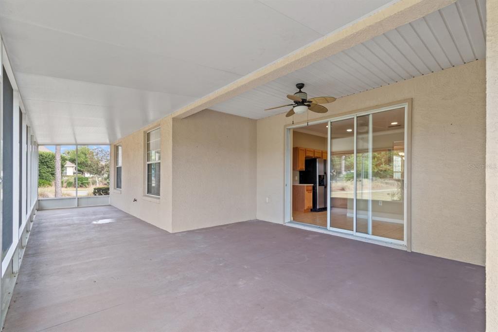 8251 Southwest 84th Place Road Ocala, FL 34481 - Photo 26 of 38 a view of a big room with windows and a chandelier