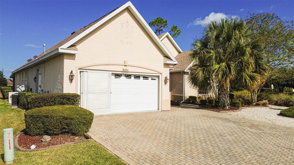 8251 Southwest 84th Place Road Ocala, FL 34481 - Photo 3 of 38 a view of a house with a yard