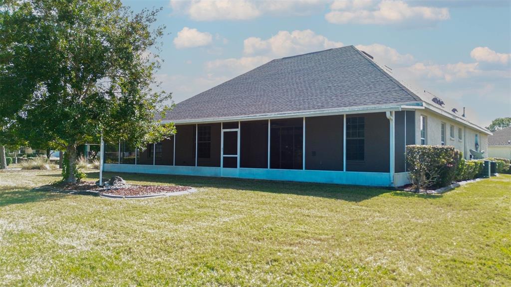 8251 Southwest 84th Place Road Ocala, FL 34481 - Photo 33 of 38 a view of a house with a yard and large tree