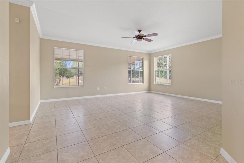 8251 Southwest 84th Place Road Ocala, FL 34481 - Photo 7 of 38 a view of an empty room with a window