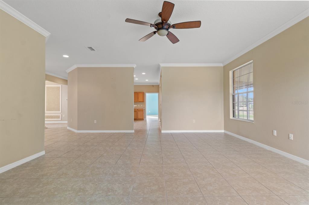8251 Southwest 84th Place Road Ocala, FL 34481 - Photo 9 of 38 a view of an empty room with a window