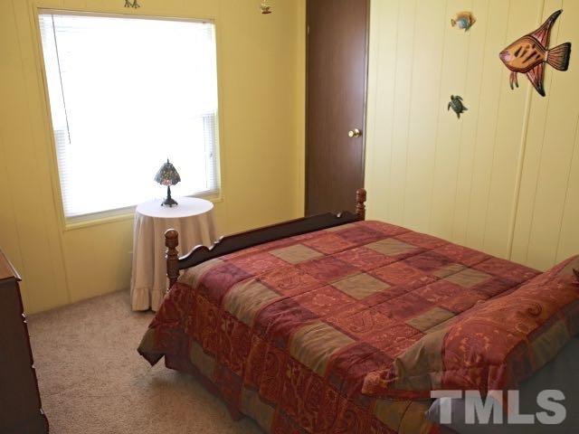9566 George Ruff Road Bullock, NC 27507 - Photo 11 of 25 a bedroom with a bed and a window
