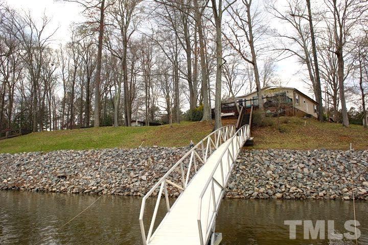 9566 George Ruff Road Bullock, NC 27507 - Photo 17 of 25 a view of a lake with a large trees