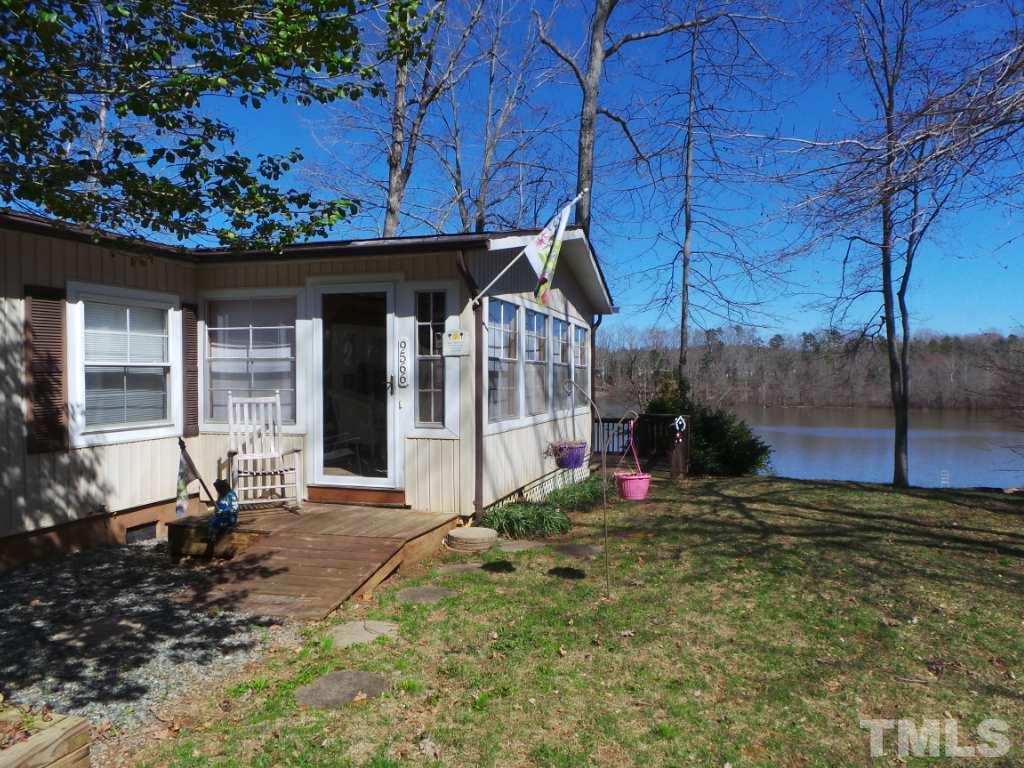 9566 George Ruff Road Bullock, NC 27507 - Photo 18 of 25 a view of a house with a small yard and sitting area
