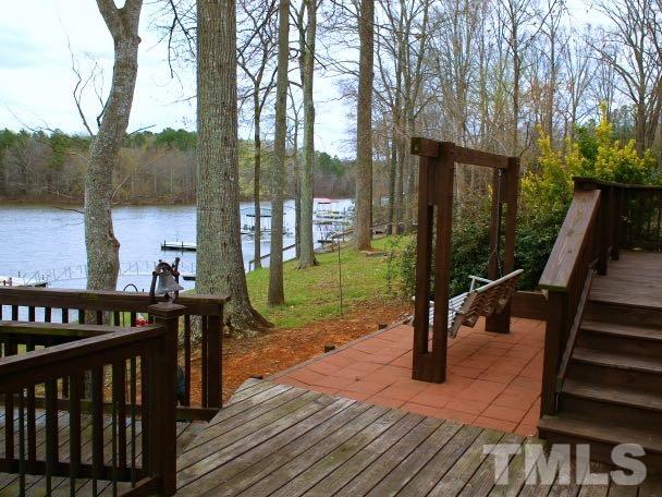 9566 George Ruff Road Bullock, NC 27507 - Photo 4 of 25 a view of a deck with wooden floor and outer view
