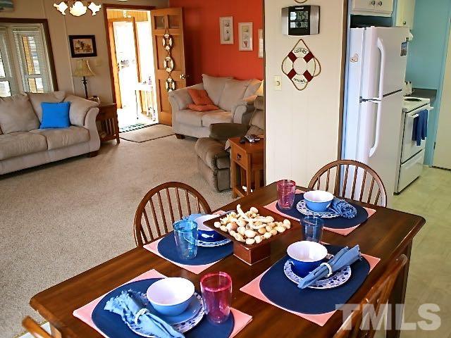 9566 George Ruff Road Bullock, NC 27507 - Photo 7 of 25 a dining room with furniture and wooden floor
