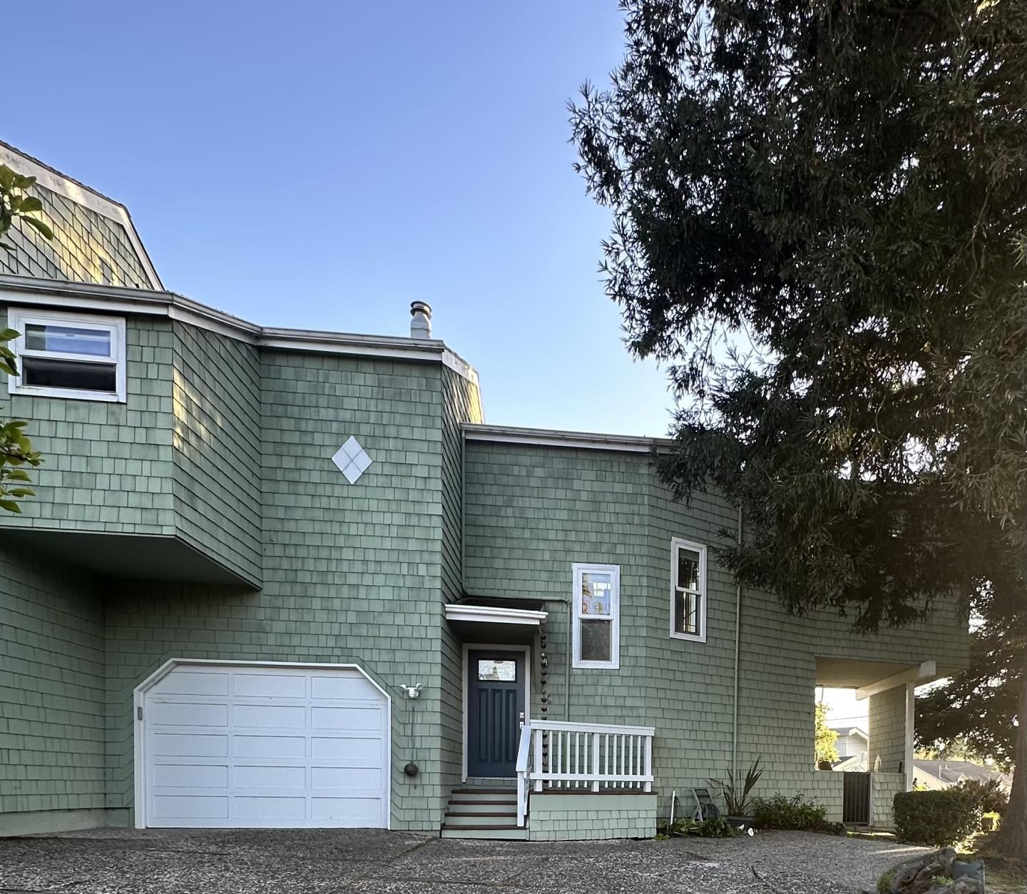 a front view of a house with parking space