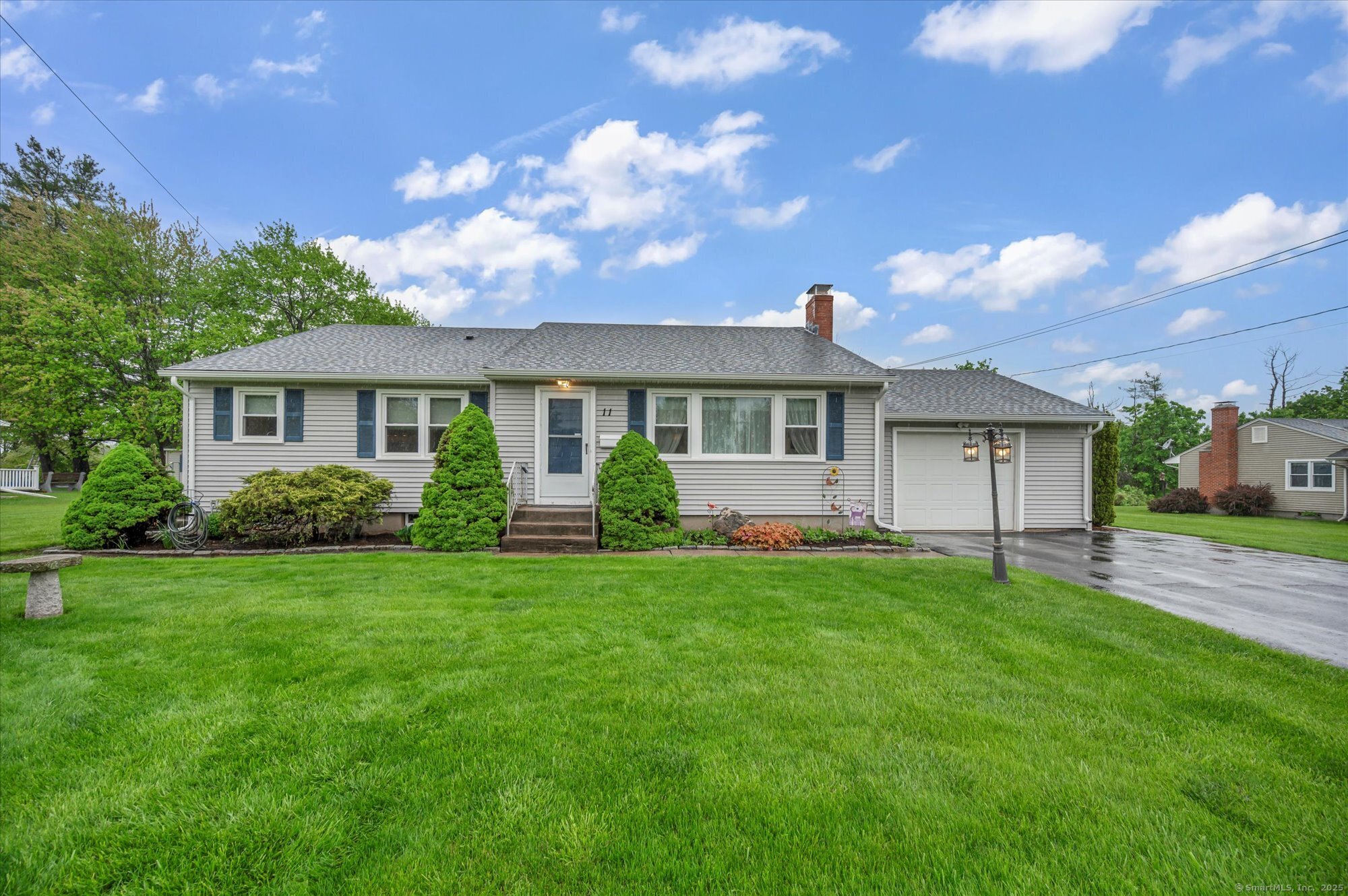 a front view of a house with a garden