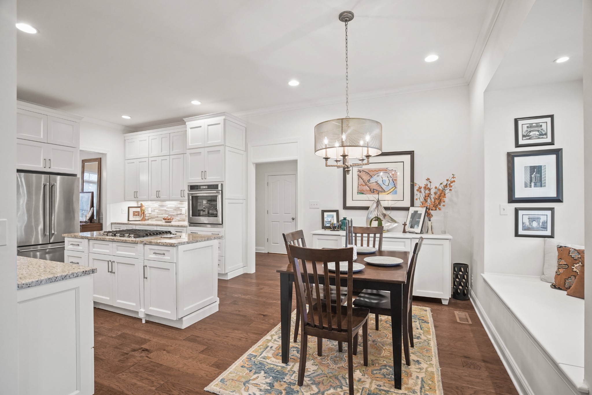 2003 Tammy Drive Springfield, TN 37172 - Photo 36 of 69 a kitchen with stainless steel appliances kitchen island granite countertop a dining table chairs stove and white cabinets