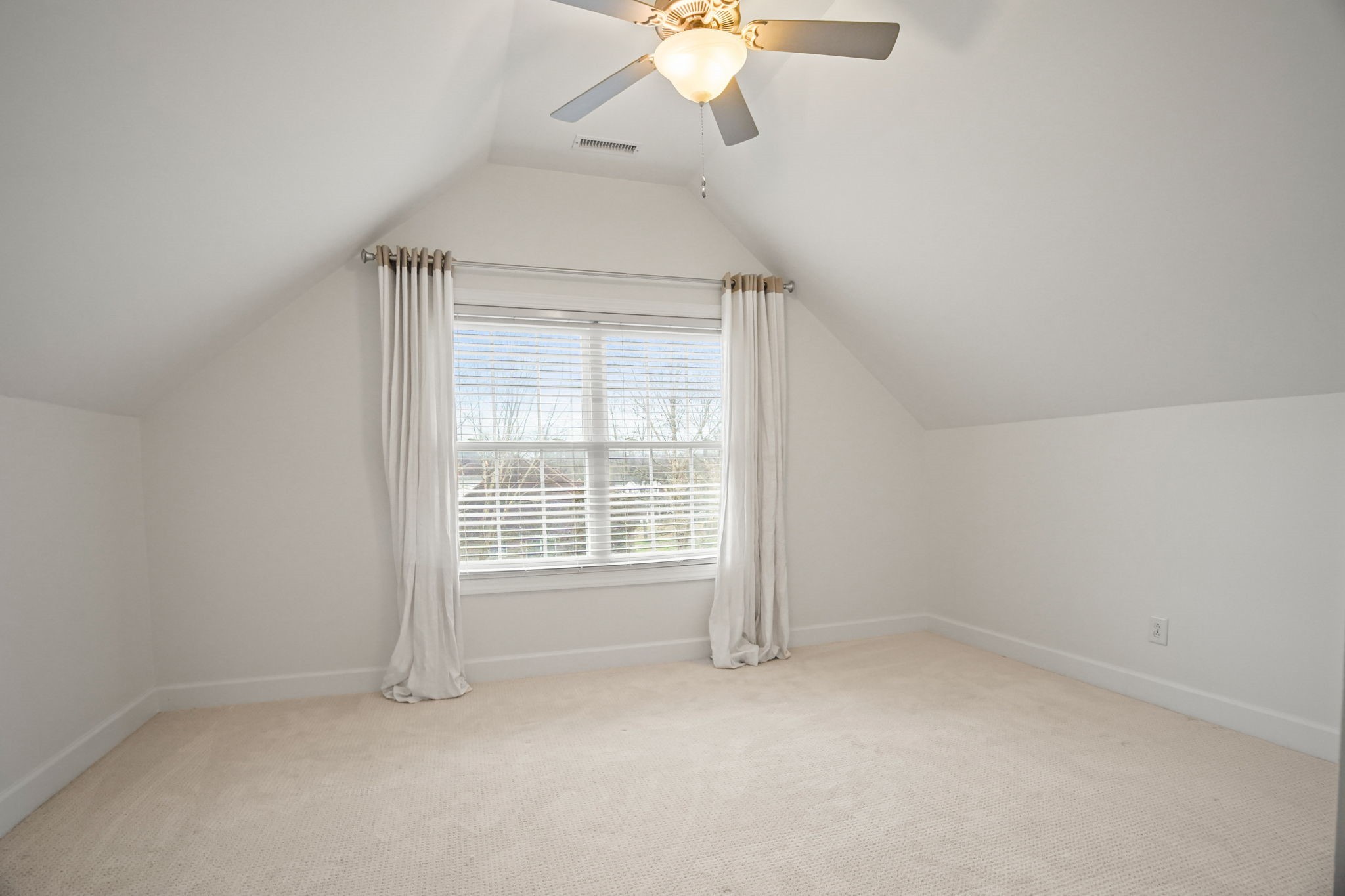 2003 Tammy Drive Springfield, TN 37172 - Photo 61 of 69 an empty room with a chandelier fan and windows