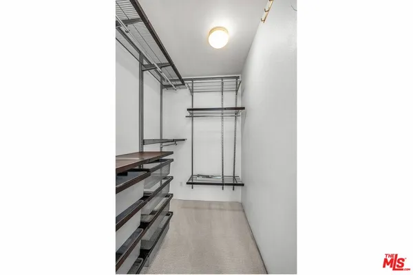 a view of a room with racks on the wall