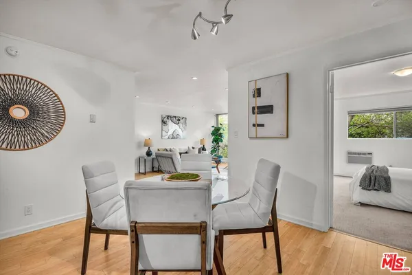 a dining room with furniture and window