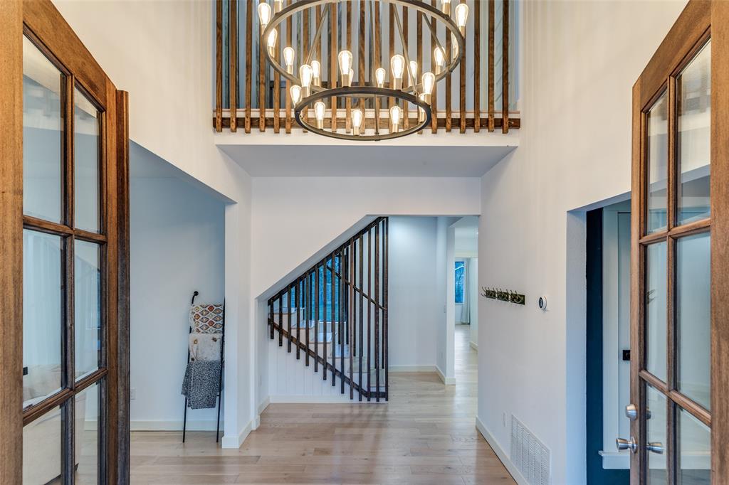 3120 Colcord Avenue Waco, TX 76707 - Photo 4 of 23 a view of a hallway with wooden floor and staircase