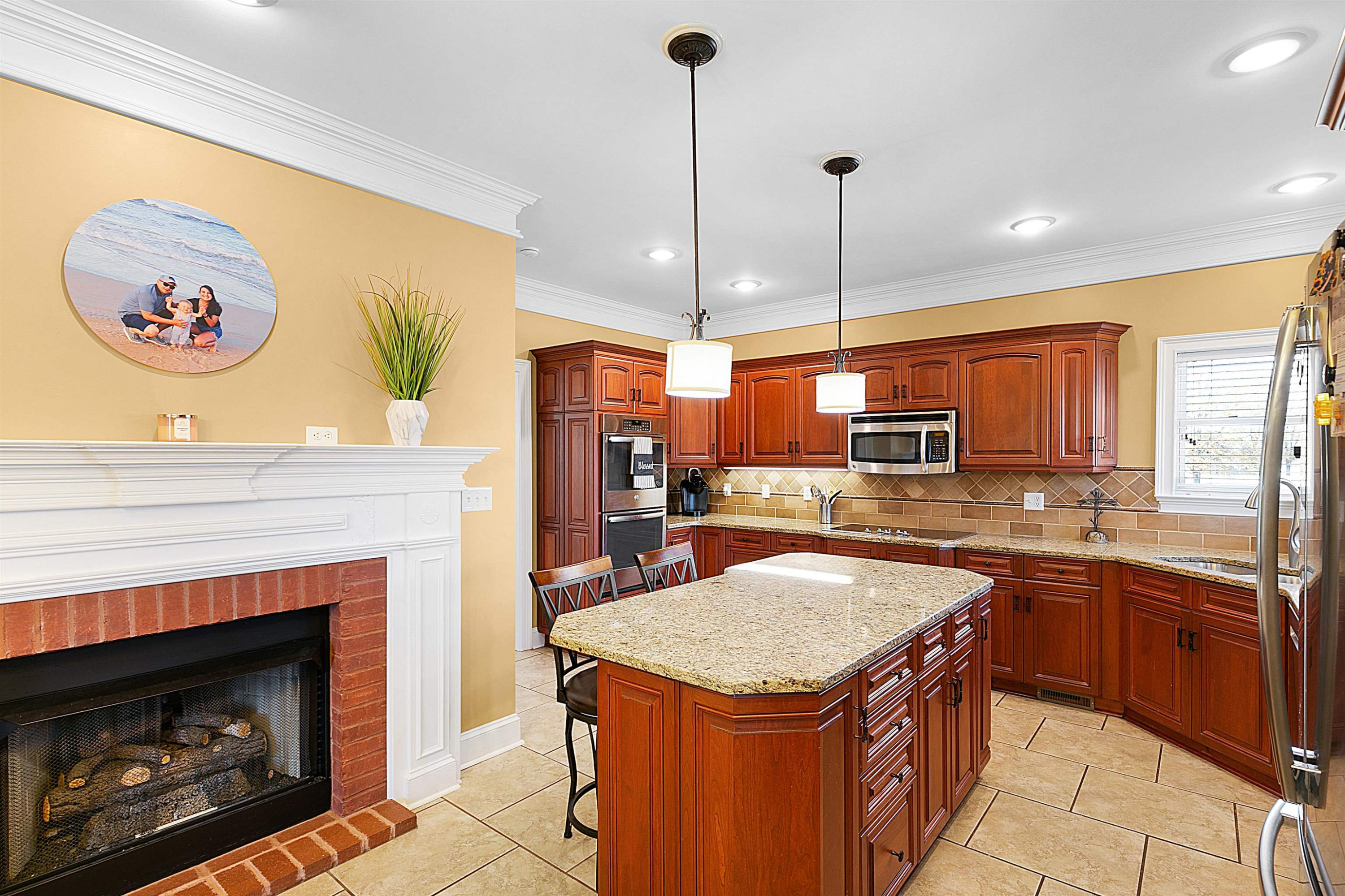 189 Rust Road Bells, TN 38006 - Photo 11 of 33 a kitchen with a sink a stove and a refrigerator
